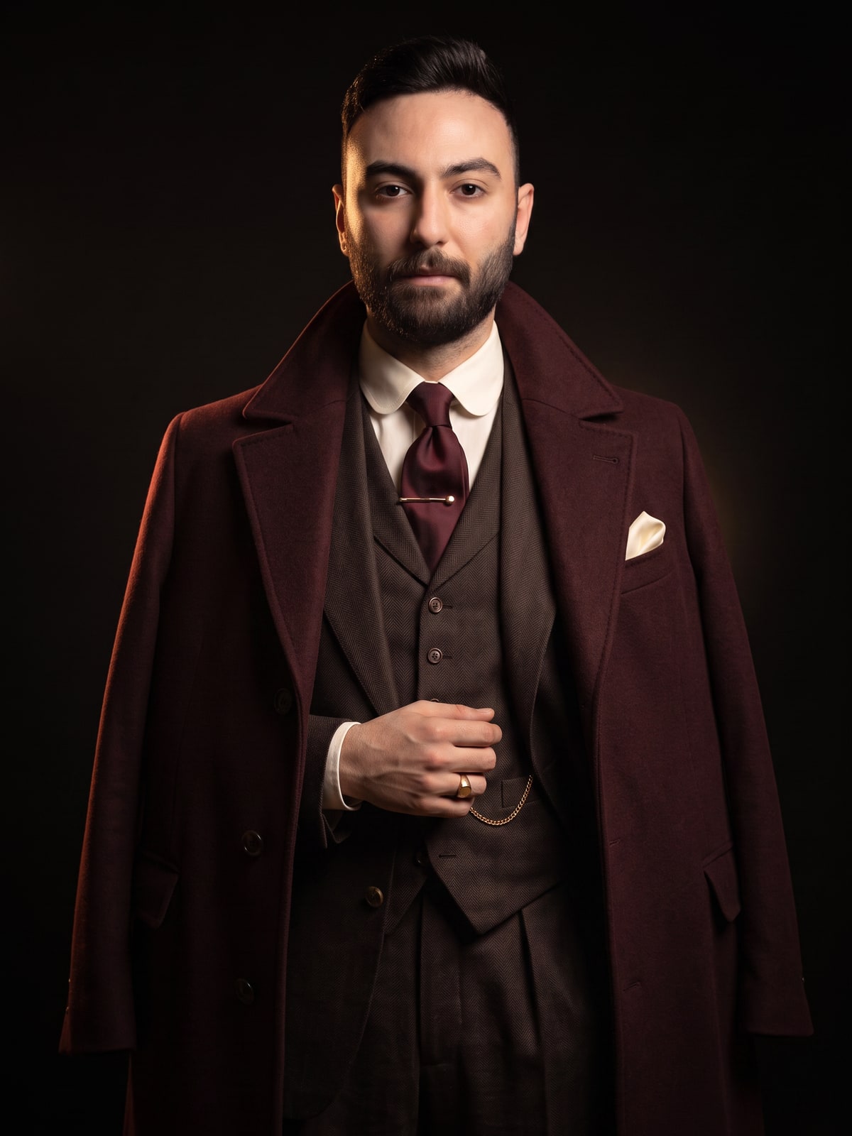 Portrait of Emad Yahya, founder of Suité, in the candlelit study of the house